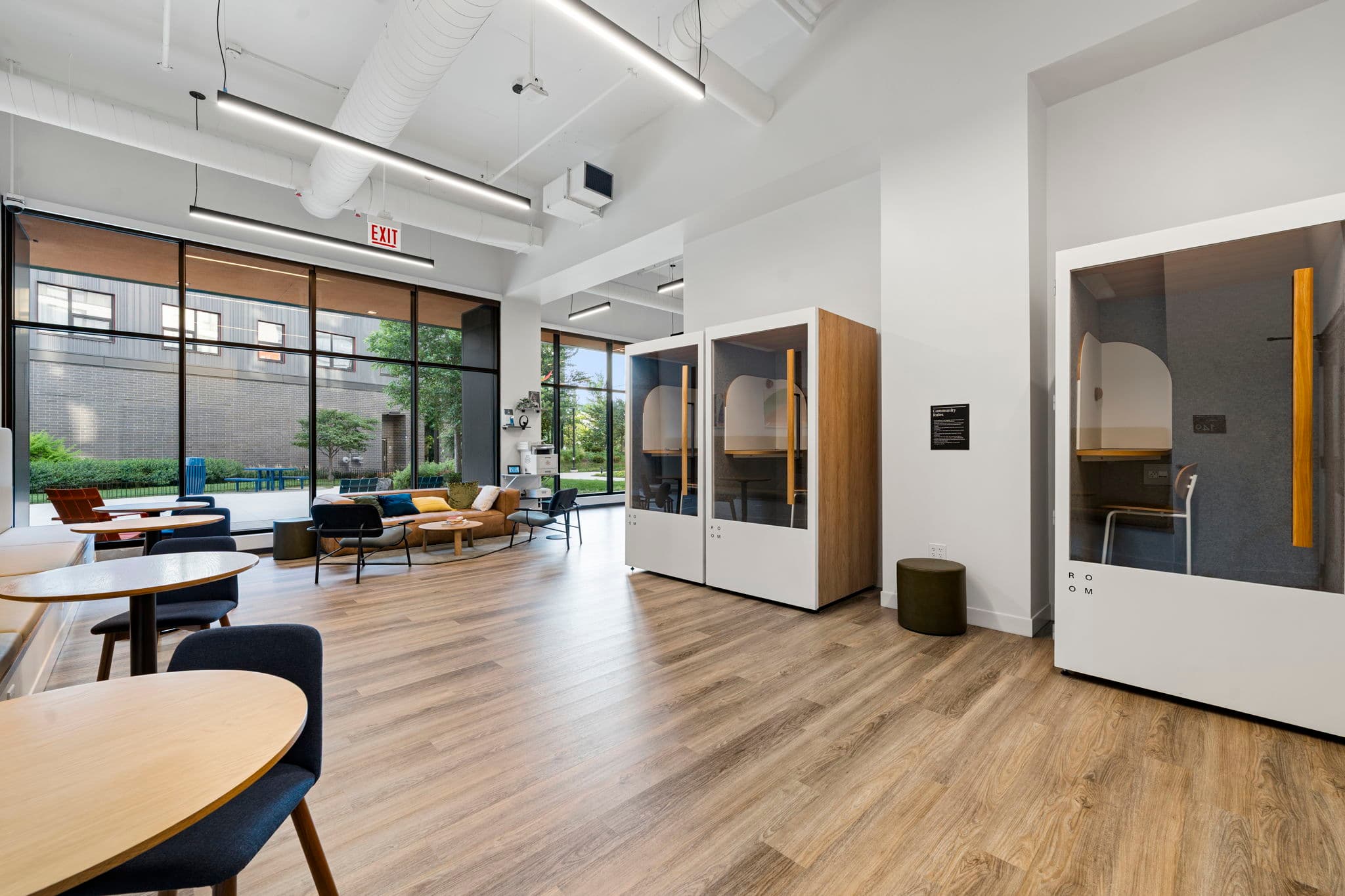 Phone booths and lounge seating in co-working space